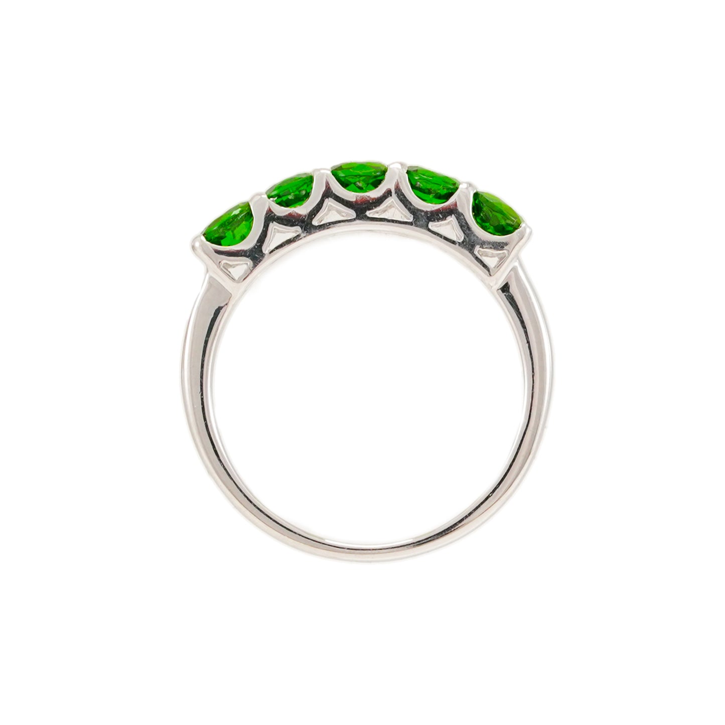 Damenring aus Weißgold mit grünen Steinen